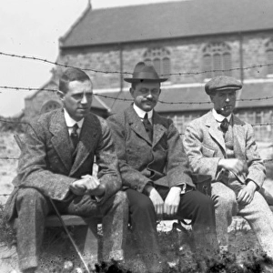 Four men on a bench at golf club