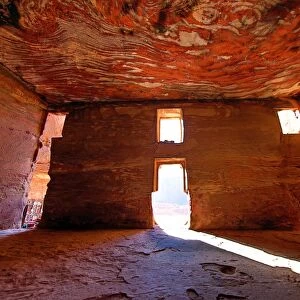 Light streaming through the windows of the Urn Tomb of the Royal Tombs in the rock city of Petra
