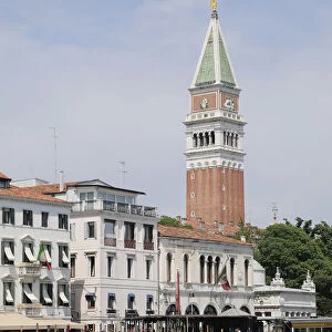 Italy, Veneto, Venice, gondolas leaving from Piazza San Marco with campanile indistance
