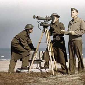 FORT STORY, 1942. American servicemen operating an azimuth instrument at Fort Story in Virginia