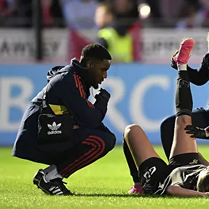 Arsenal Women's Star Gio Queiroz Receives Treatment from Physio during Brighton Match