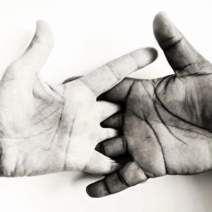 Two hands, of different skin colors, symbolizing brotherhood