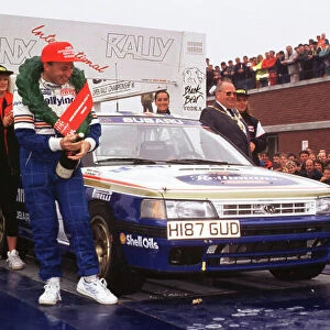 1991 British Rally Championship. Manx Rally, Great Britain. Colin McRae/Derek Ringer (Subaru Legacy RS) Ist position. McRae and Ringer celebrate on the podium, they won the British title the same year. World LAT Photographic